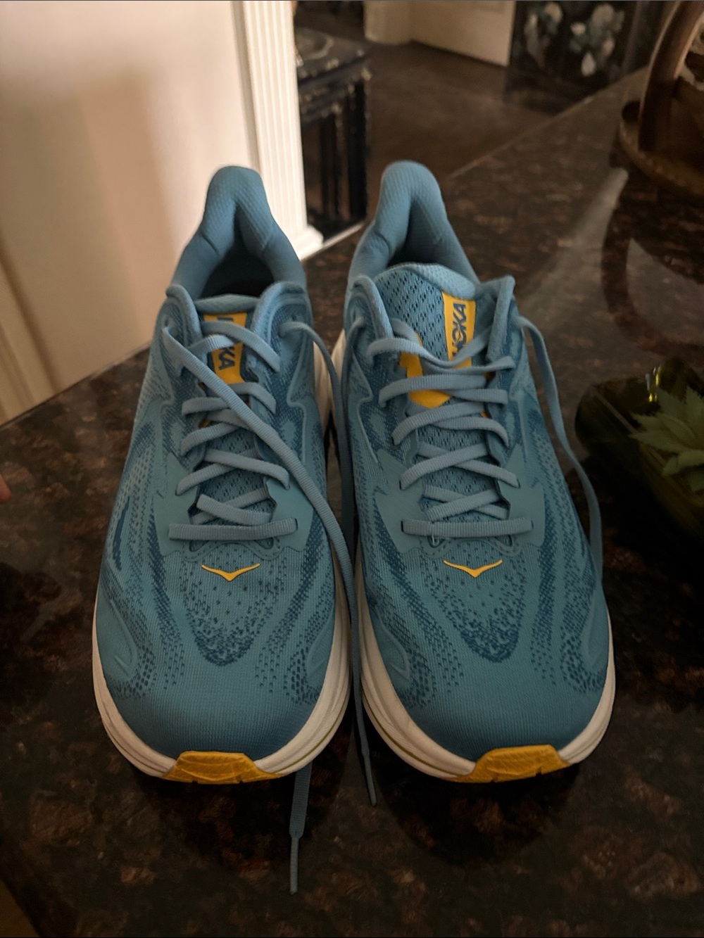 Hoka Light Blue Running Shoes with Yellow Accents